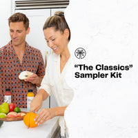 Couple preparing fresh produce in a kitchen for The Classics Sampler juice kit